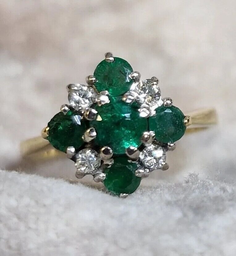 Emerald and diamond cluster ring in yellow gold